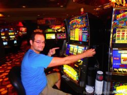 Pavel playing coin machines in Vegas